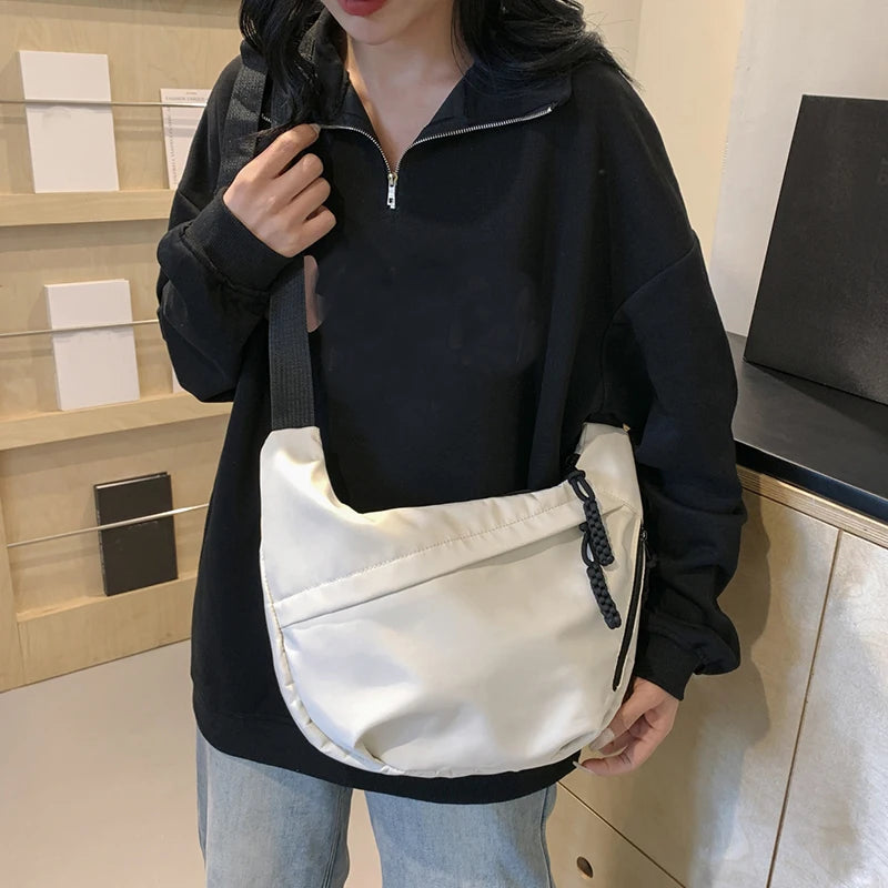 Neutral style tote bag with strap for carrying fitness items. New mini street-style handbag with shoulder strap. Lightweight and